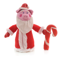 Pig of plasticine dressed as a santa.