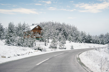 Wooden house in the mountains. Mountain resort in a winter wonderland
