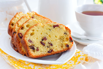 Raisin cupcake on a white plate, selective focus