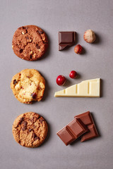 Fresh chocolate chip cookies pattern on grey background