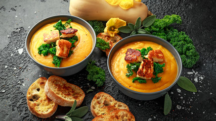 Baked butternut squash and carrot cream soup with steamed kale and fried halluomi