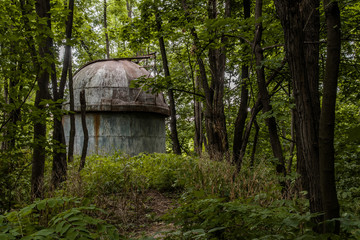 Old abandoned observatory in forest