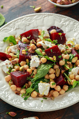 Healthy Beet Salad with chickpeas, pistachios nuts, feta and melted cheese toast