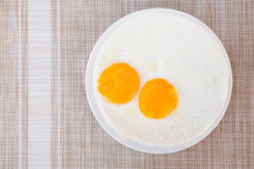 Two Fried Eggs Served On White Plate