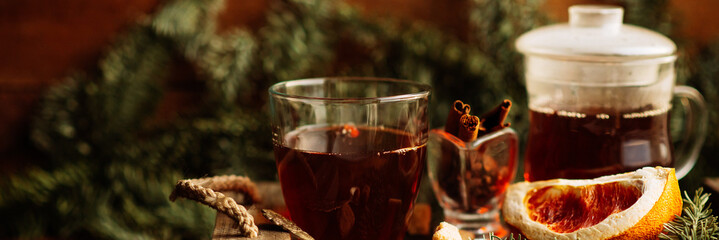 hot pink tea with cinnamon in a transparent mug, rustic style