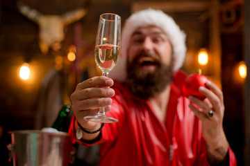 Santa Claus congratulation you with glass champagne. Comic Santa Claus. Celebrate at home. New Year traditions. Cheerful concept.