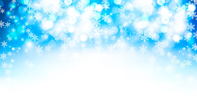 winter blue bokeh background with falling snowflakes