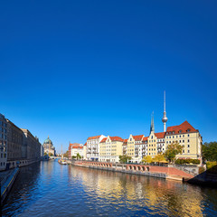 Fototapeta na wymiar Riverside with old houses in East Center of Berlin, Germany, text space