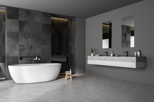 Black tile bathrom corner, tub and sink