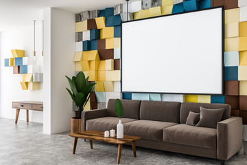 Colored living room corner, brown sofa, poster