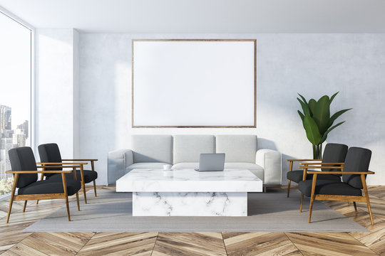 White living room, white sofa and poster