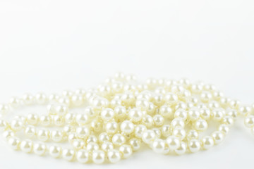 Soft focus of pearl necklace on white background, luxury ornament and lifestyle concept