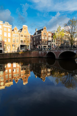 Dutch scenery with canal and mirror reflections at spring day, Amsterdam, Holland Netherlands