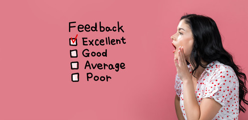 Feedback with young woman speaking on a pink background