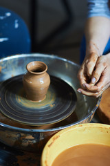 Master class on modeling of clay on a potter's wheel In the pottery workshop