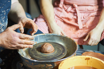 Master class on modeling of clay on a potter's wheel In the pottery workshop