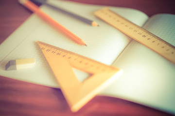 Colorful stationery on a brown wooden table.