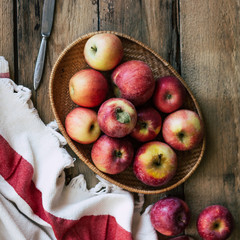 Red apples, harvest, wooden background, old boards, rustic style, top view