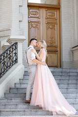 Fototapeta premium wedding couple in city in sunny summer day.