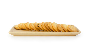 arrange cookie on wood plate in white background