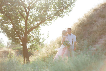wedding couple on the nature in summer day.