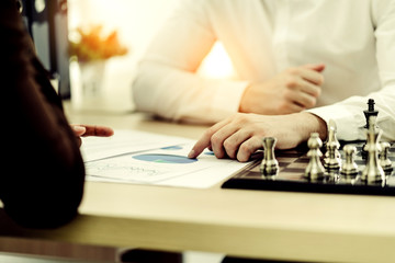 business competition ideas concept two business man play chess board game on desk strategy and organize method