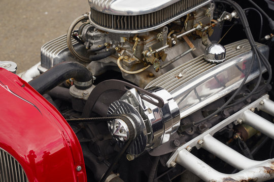Image of the engine of the old car. Dual carburetor.