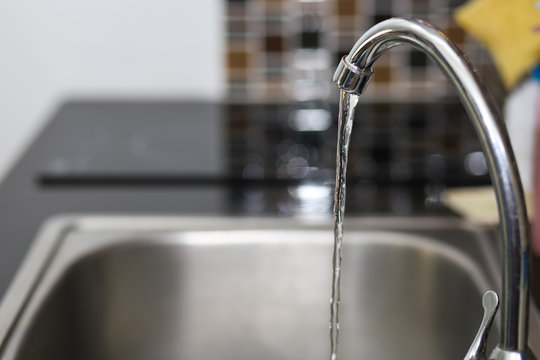 Faucet Sink And Water Tab Decoration In Kitchen Room Interior.