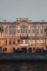 Obraz premium Elements of architecture of historical buildings. The streets of St. Petersburg with its bridges and rivers. Night view of the city at sunset.