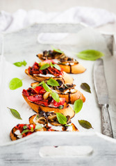 Sun dried tomatoes, cream cheese and fried mushrooms bruschetta