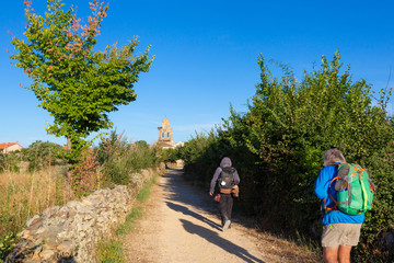 Camino de Santiago (Spain) - Pilgrims walking along the way of St.James, in the spanish meseta