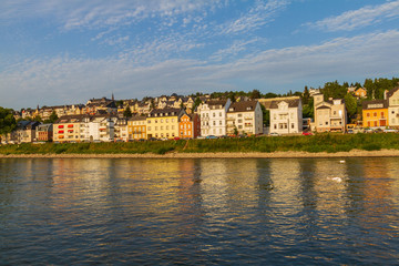 Fototapeta na wymiar Koblenz residential section on the bank of river Rhine bathed in afternoon light.