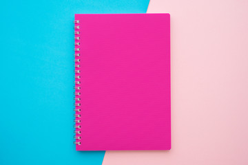 Pink notepad on pink blue background - Business education stationery