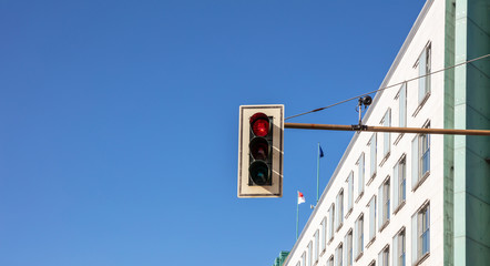 Red traffic lights for cars, blue sky background