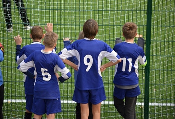 young soccer players support their team
