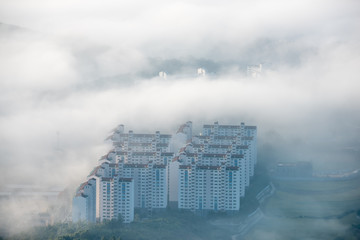 The view of an apartment surrounded by fog is fantastic