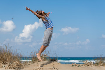 girl jumping on the beach