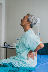 pain and backache old senior asian grandfather in patient uniform suffer from body problem  health...