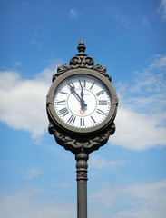 old street clock and blue sky