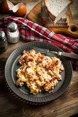Scrambled eggs with sausage.