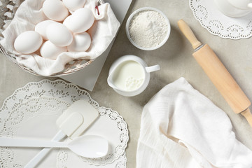 Fototapeta na wymiar Flat Lay Baking Still Life: Predominantly white kitchen items for baking.