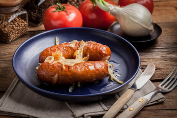 Fried sausage with onions.