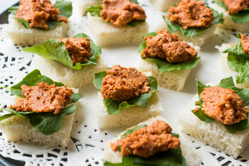 Canape with Muhammara, Adjika, Ajika or Acuka on Small Square Breads with Round Plate.