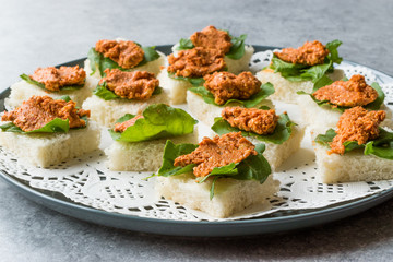 Canape with Muhammara, Adjika, Ajika or Acuka on Small Square Breads with Round Plate.