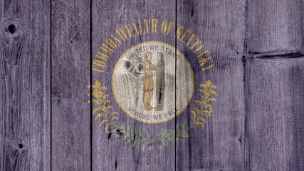 Obraz na płótnie Canvas USA Politics News Concept: US State Kentucky Flag Wooden Fence