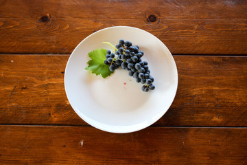 Grapes on the white plate