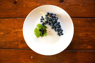 Grapes on the white plate