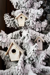 Artificial Christmas tree with snow, decorated with Christmas tr