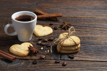 Coffee and cookies in the shape of a heart