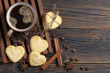 Coffee and cookies in the shape of a heart